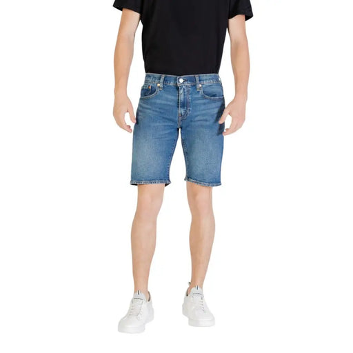 Men’s blue denim shorts with a classic five-pocket design and a slightly faded wash in blue denim fabric
