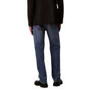Men’s blue jeans in medium-wash denim with classic straight-leg cut visible stitching and standard back pockets shown from back