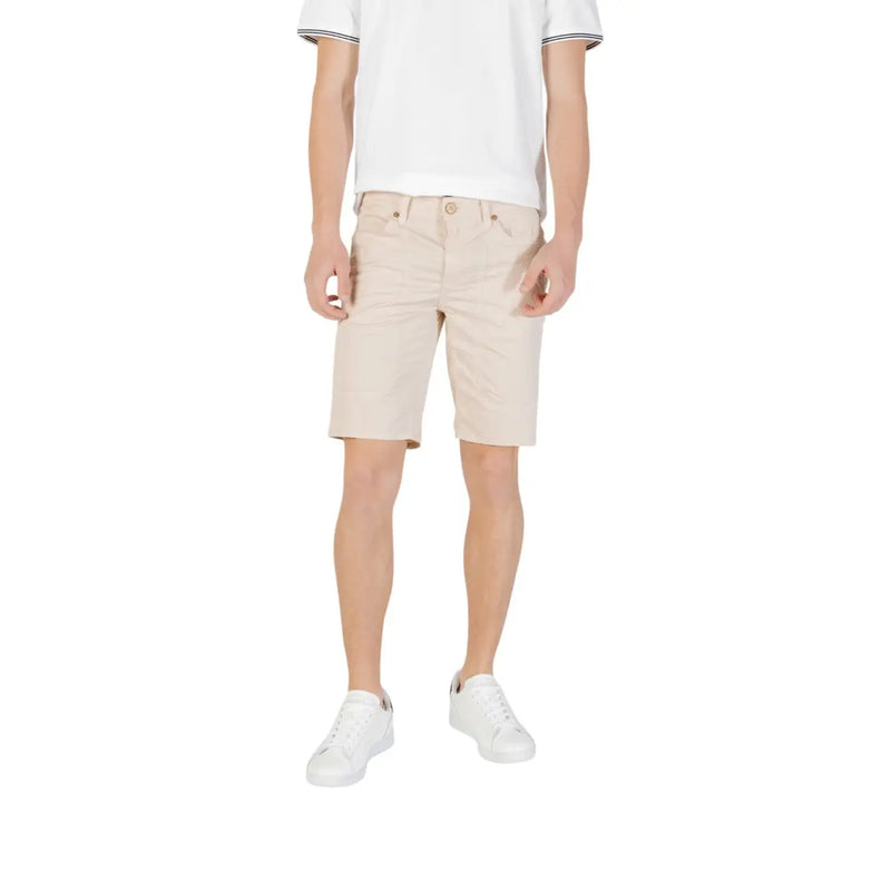 Man wearing beige shorts and white sneakers from Mens Casual Shorts T Shirt And Sneaker Collection