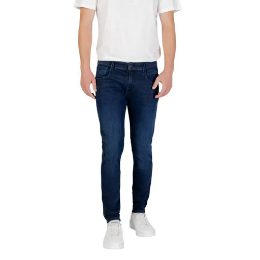 Mens dark blue slim fit denim jeans with classic five-pocket design and subtle fading for a worn-in look