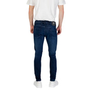 Mens dark blue slim fit denim jeans with subtle fading and rizla brand label on the back waistband visible