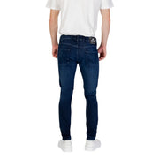 Mens dark blue slim fit denim jeans with subtle fading and rizla brand label on the back waistband visible