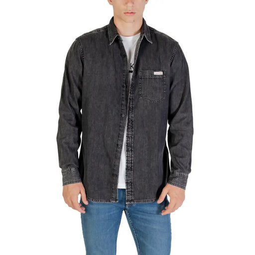Men’s gray denim long sleeve shirt with dark gray fabric button-up front chest pocket and subtle stitching details