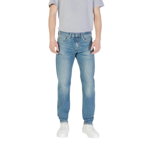 Men’s light blue denim jeans made of light-wash denim with a classic five-pocket design and faded worn-in look