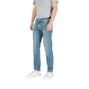Men’s light blue denim jeans with a slim fit, subtle fading, classic stitching, and branded patch on the back pocket view