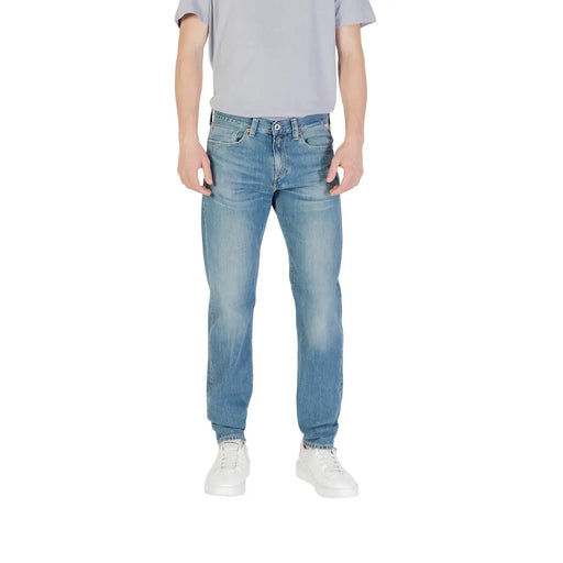 Men’s light blue denim jeans made of light-wash denim with a classic five-pocket design and faded worn-in look
