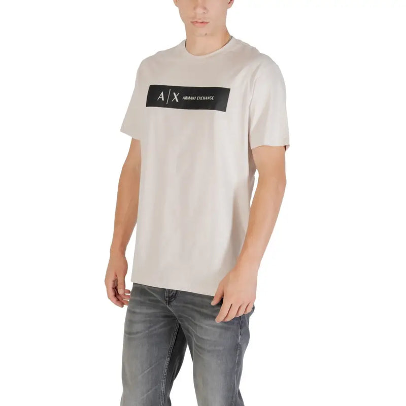 Beige Armani Exchange mens t shirt with black rectangular logo across the chest in light colored fabric