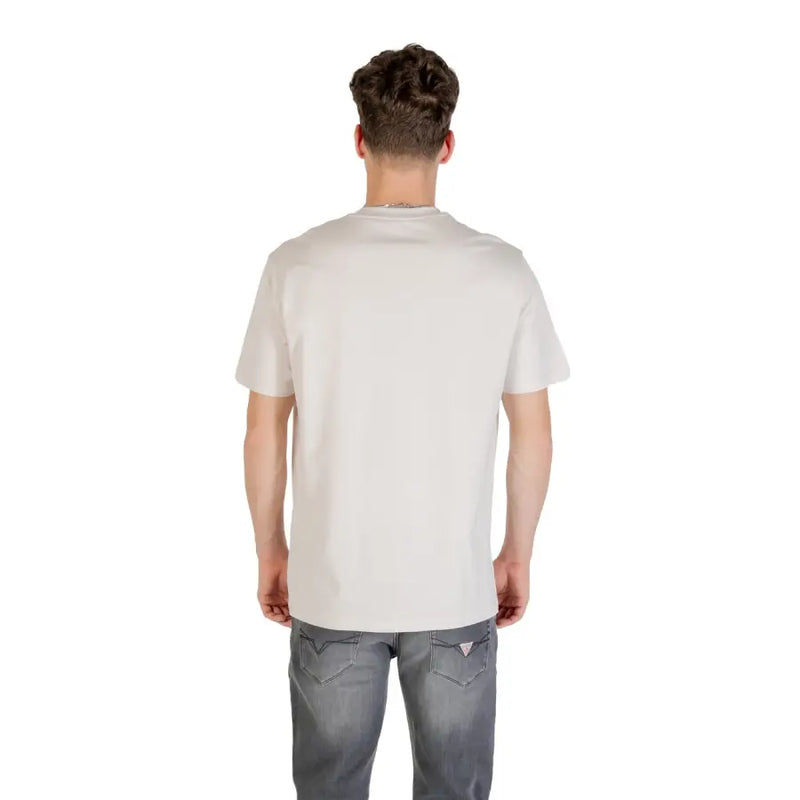 A man wearing a mens light colored off-white short-sleeved t shirt with a subtle crew neckline and no logos