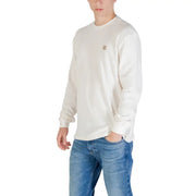 Men’s cream-colored long sleeve cotton crewneck sweatshirt with a small embroidered logo on the left chest