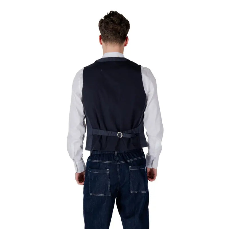 Men’s navy vest tailored in fabric with a belt and silver buckle for a polished formal look