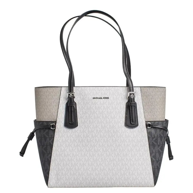 Michael kors black slip on tote bag with white and gray monogram pattern black leather trim and side pockets with drawstrings