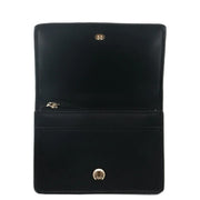 Black velvet Michael Kors women wallet with gold-tone hardware and zipper closure measuring 10.5x8x3 cm