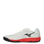 White and red mizuno volleyball shoe with black accents.