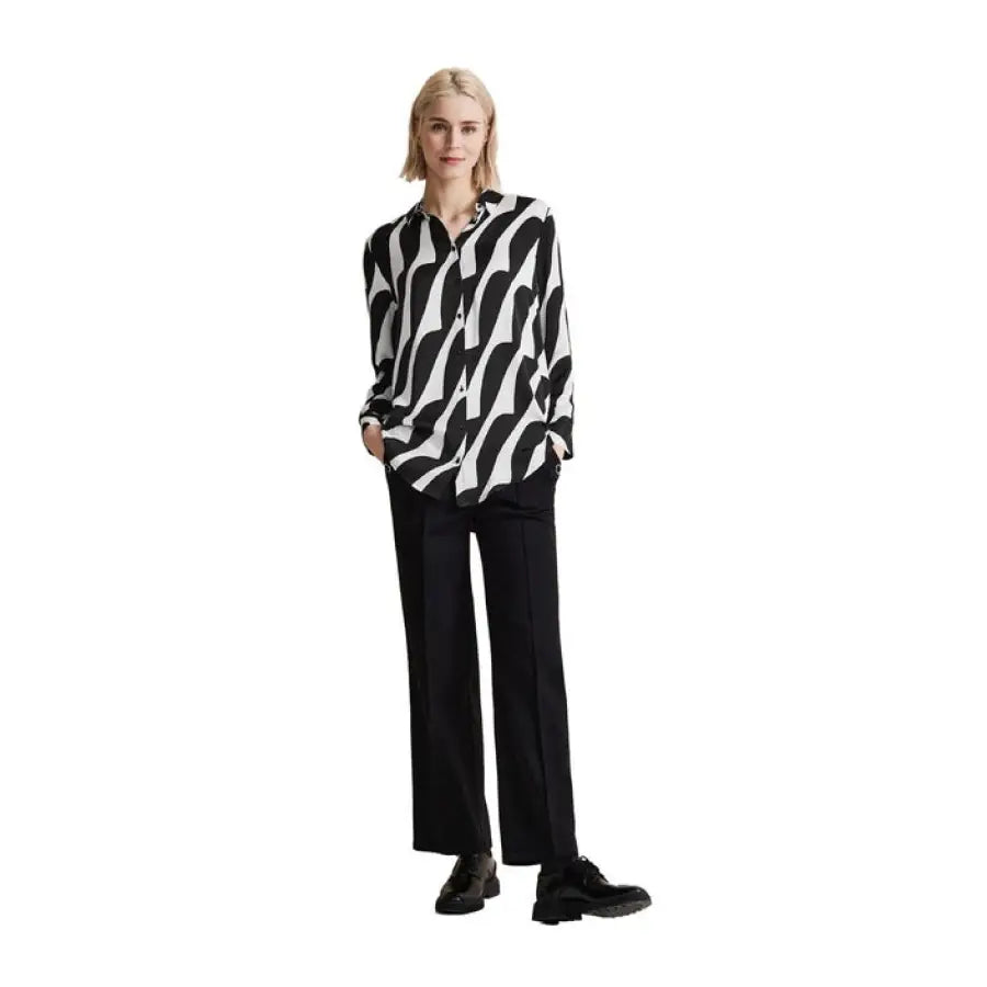Urban style: Model in black and white shirt and black pants - Street One Women Blouse