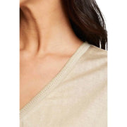 Morgan De Toi beige short sleeve v neck blouse in knit fabric with subtle sheen and delicate eyelet trim along neckline