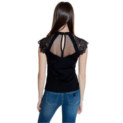 Morgan De Toi black sleeveless turtleneck blouse with lace shoulder accents and mesh back panel for women
