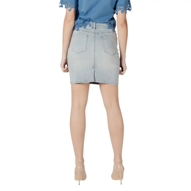 Back view of morgan de toi light blue cotton blend denim mini skirt with classic pocket design and subtle stitching details