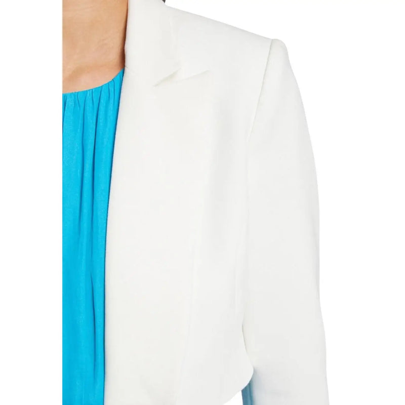 White tailored blazer with clean lines worn over bright blue top from Morgan De Toi spring summer collection