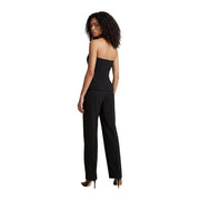 Black strapless fitted jumpsuit with tailored trousers paired with high heels from Morgan De Toi cotton collection