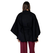 Morgan de toi women black wool blend cape with belted waist and wide flowing sleeves, shown from the back side