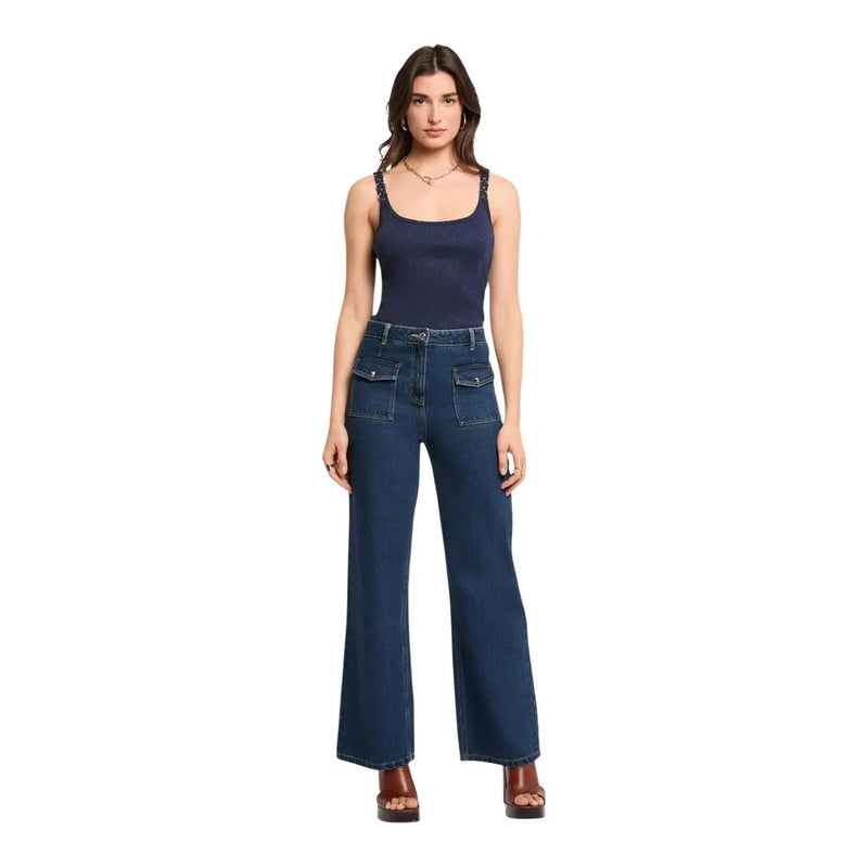 Dark blue high-waisted denim jeans with front pockets and flared legs paired with morgan de toi blue viscose top