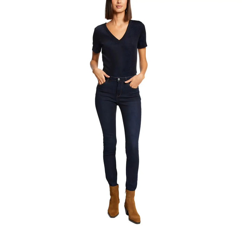 A pair of dark navy high-waisted skinny jeans with classic five-pocket design paired with morgan de toi blue v neck polyester t shirt plain short