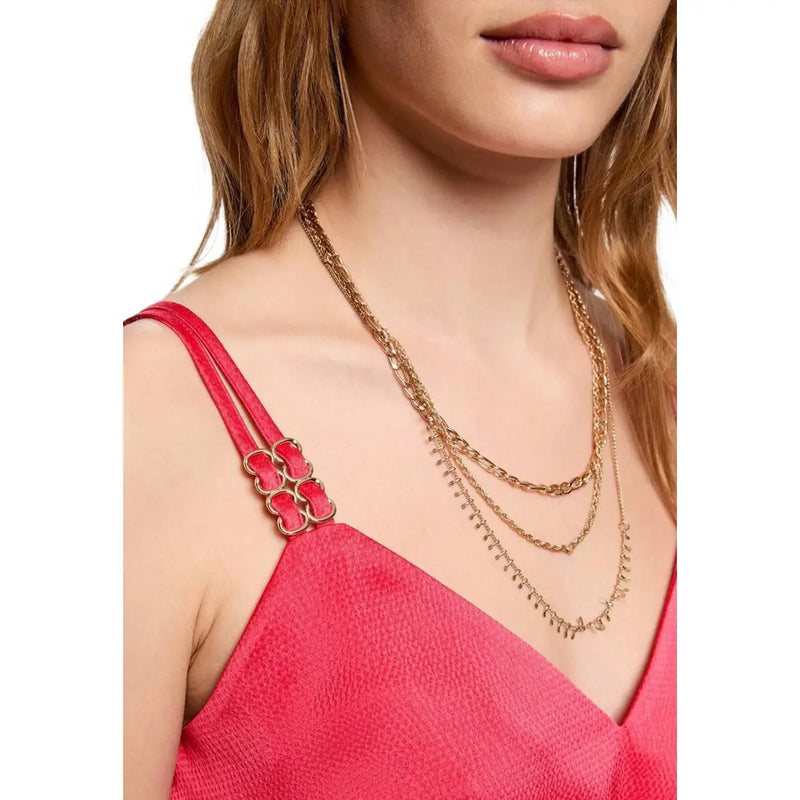 Gold-toned layered chain necklaces with dangling spike details complementing morgan de toi women coral v neck straps top 242 olafi