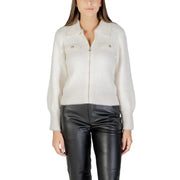 Women’s cream-colored fuzzy zip-up collared sweater with gold buttons paired with black faux leather pants