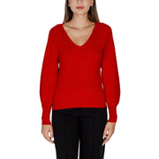 Women wearing Morgan De Toi red long-sleeved V-neck sweater with black trousers