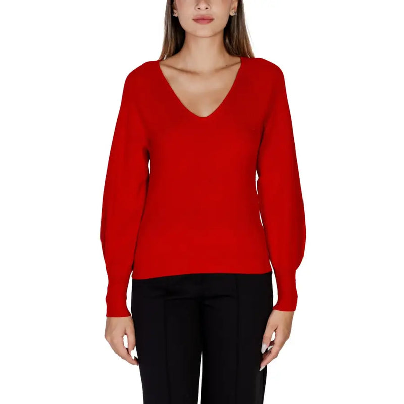 Women wearing Morgan De Toi red long-sleeved V-neck sweater with black trousers
