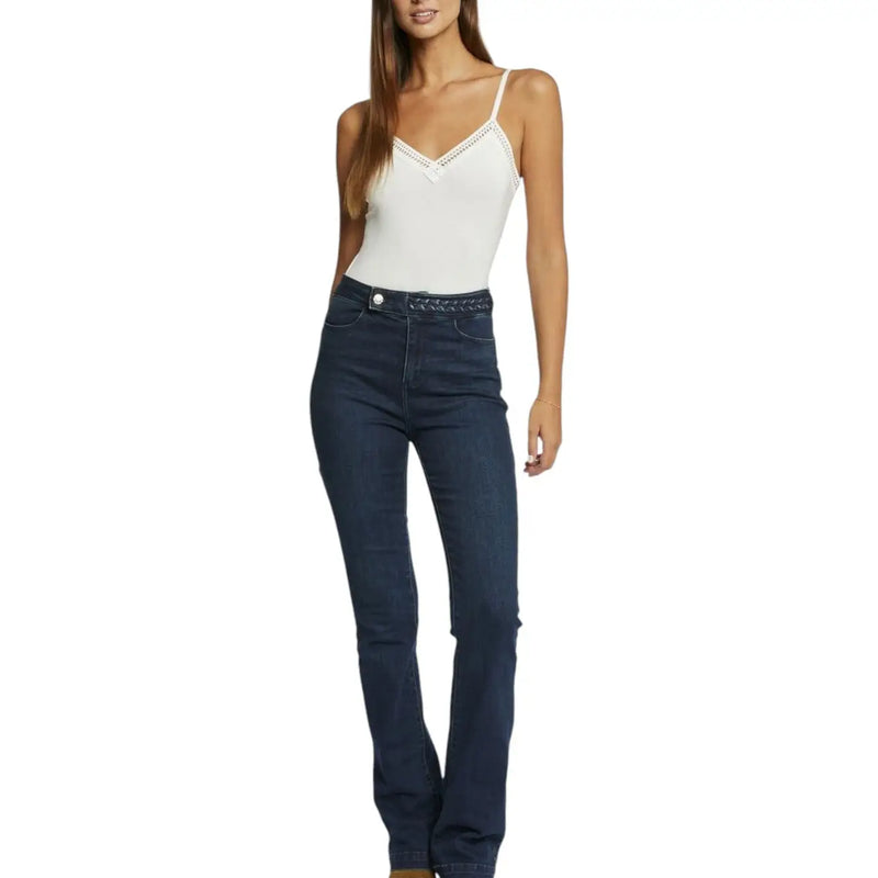 Dark blue high waisted denim jeans with flared leg and decorative waistband stitching paired with white viscose elastane tank top