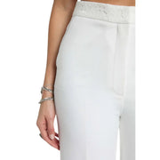 White high-waisted Morgan de toi women trousers with zip front pockets and textured lace waistband detail