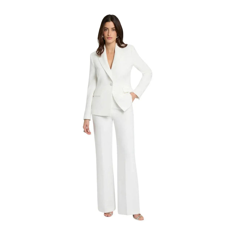 White tailored blazer with single button closure paired with Morgan De Toi women trousers white zip front pockets