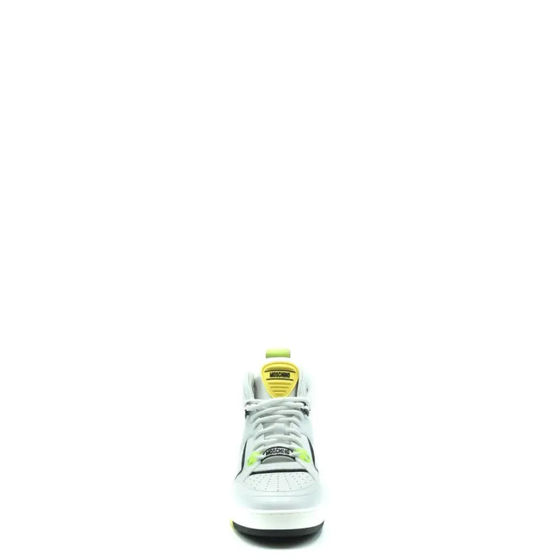White moschino men leather high-top sneaker with neon green black accents and yellow tongue label for sporty use