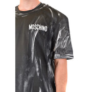 Black Moschino men t-shirt with white brushstroke pattern and brand name printed across the chest