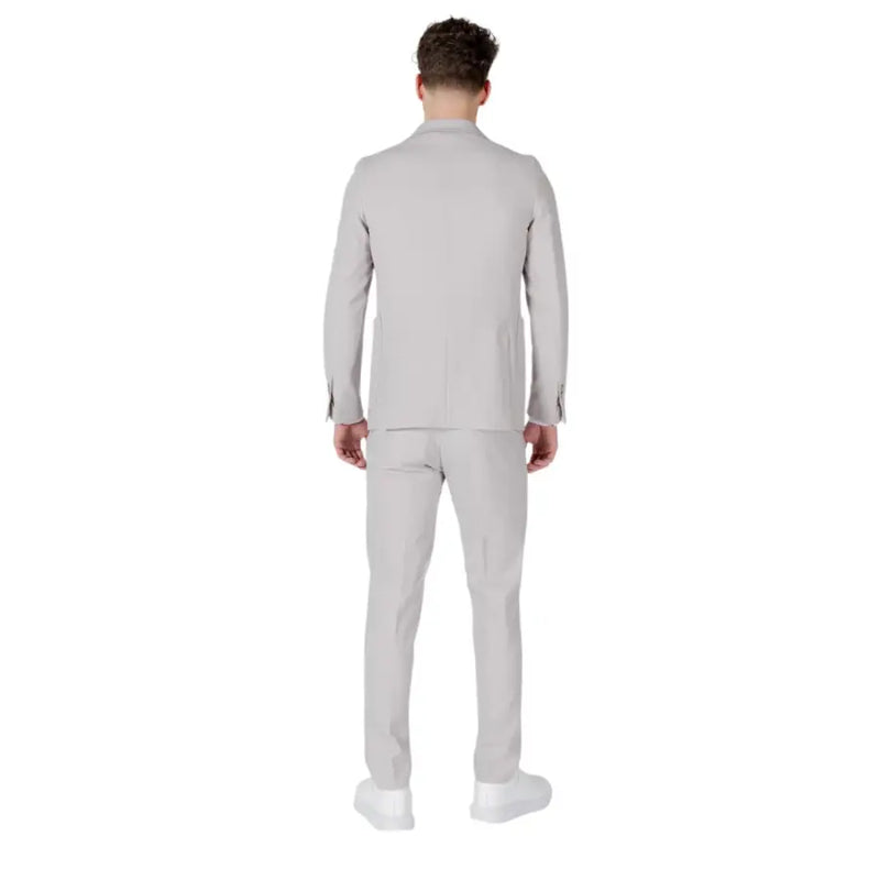 A sleek light gray mulish men slim fit suit made of polyester viscose blend with a modern tailored cut and subtle texture