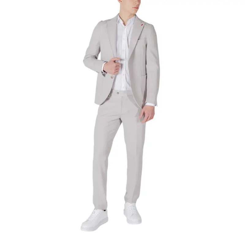 Mulish men grey slim fit suit in polyester viscose blend worn over white dress shirt with white sneakers