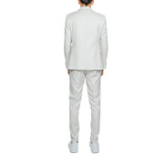 A crisp white tailored suit with a structured blazer and matching trousers made from smooth polyester viscose blend fabric