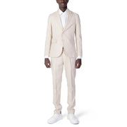 A man wearing a cream-colored Mulish men suit made of beige polyester viscose blend with white dress shirt and matching trousers