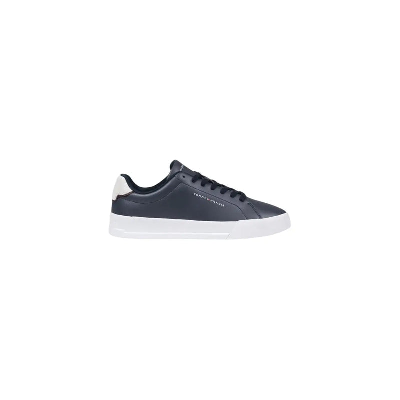 Dark navy leather Tommy Hilfiger low-top sneaker with white rubber sole and cream-colored heel tab visible from the back