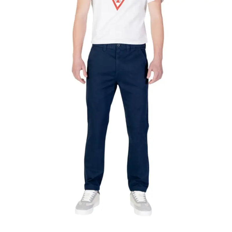 Navy blue Tommy Hilfiger men’s jeans trousers displayed on a neutral background