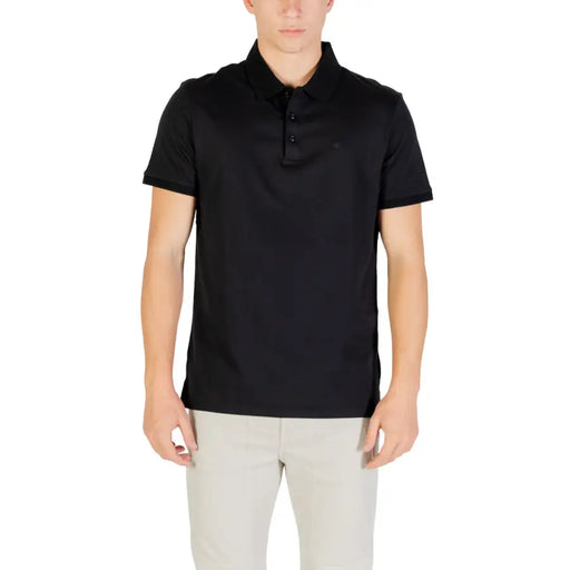 Black polo shirt with short sleeves and a collar, made of cotton.