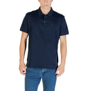 Navy blue short-sleeved polo shirt with subtle embroidered logo on chest made from breathable fabric for casual wear