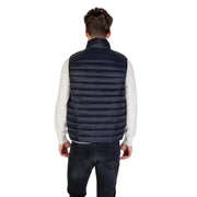 Navy blue quilted puffer vest made of insulated material for warmth and outdoor use