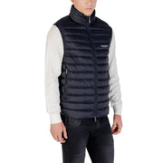 Black quilted puffer vest with high collar and front zipper featuring Armani Exchange logo on chest in navy blue puffer vest product