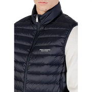 Black quilted puffer vest with high collar front zipper and armani exchange logo embroidered on chest in navy blue product listing