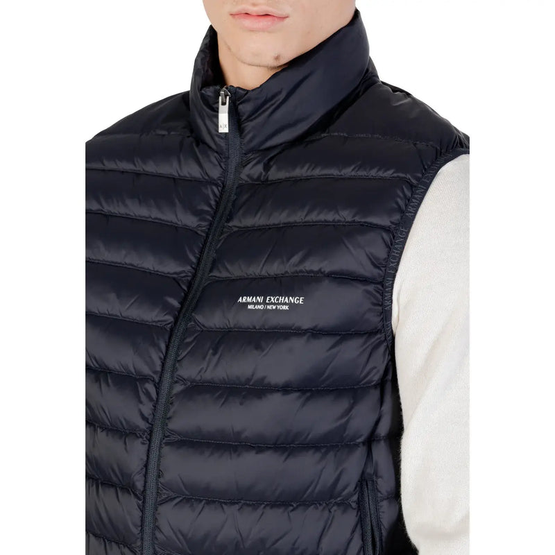 Black quilted puffer vest with high collar front zipper and armani exchange logo embroidered on chest in navy blue product listing