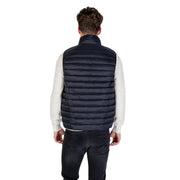 Navy blue quilted puffer vest made of insulated material for warmth and outdoor use