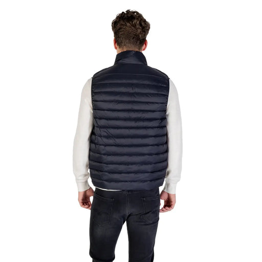 Navy blue quilted puffer vest made of insulated material for warmth and outdoor use