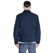 Navy blue quilted puffer jacket displayed as a stylish winter outerwear piece